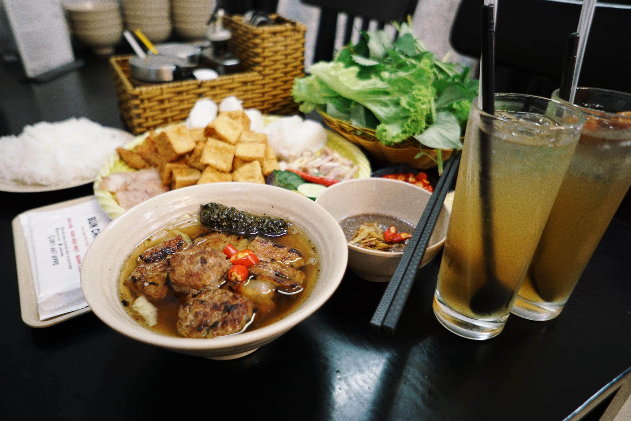 The flavor of the bun cha is elevated by the addition of fragrant grilled beef wrapped in betel leaves